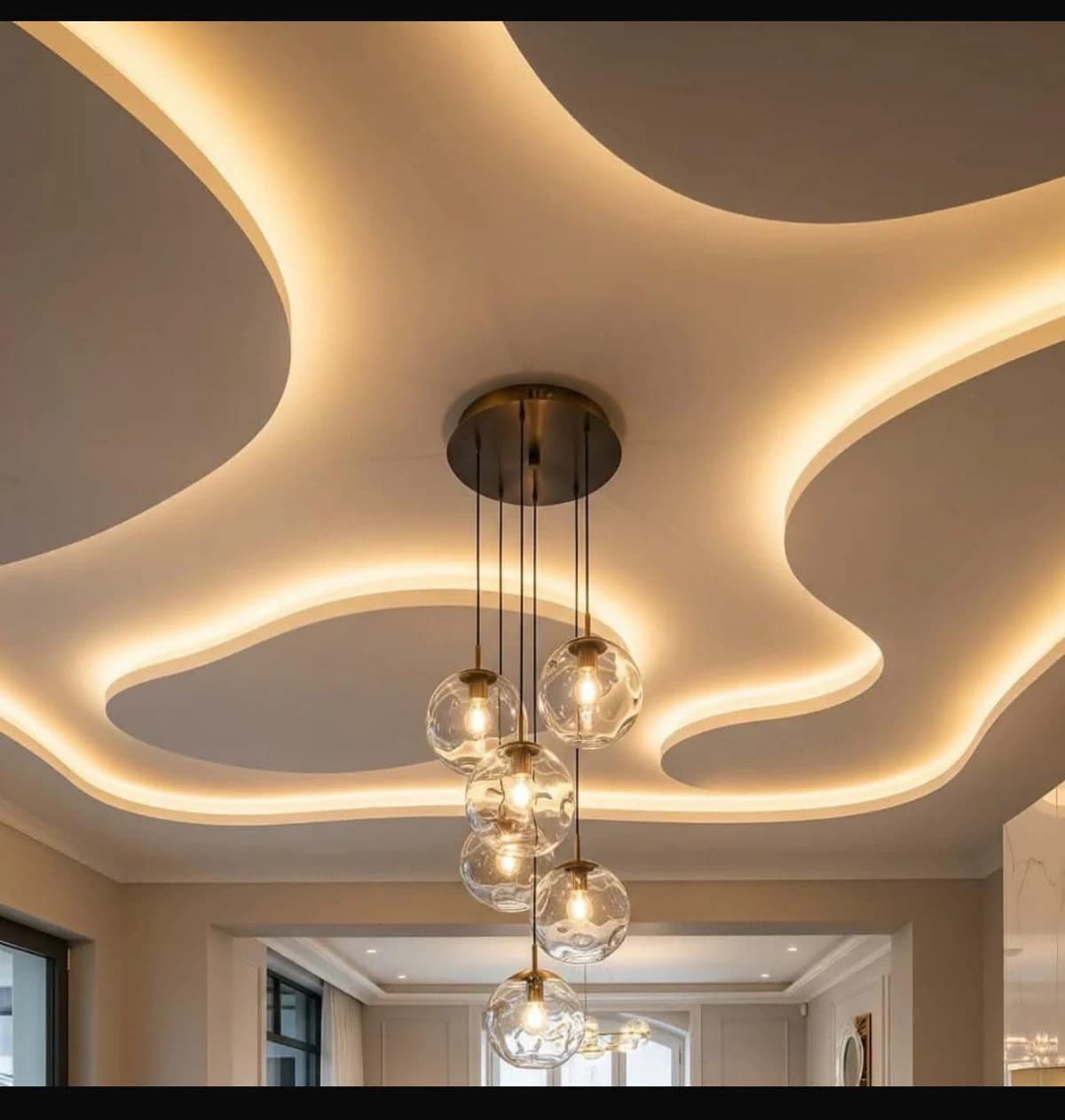 Layered false ceiling with warm lighting details